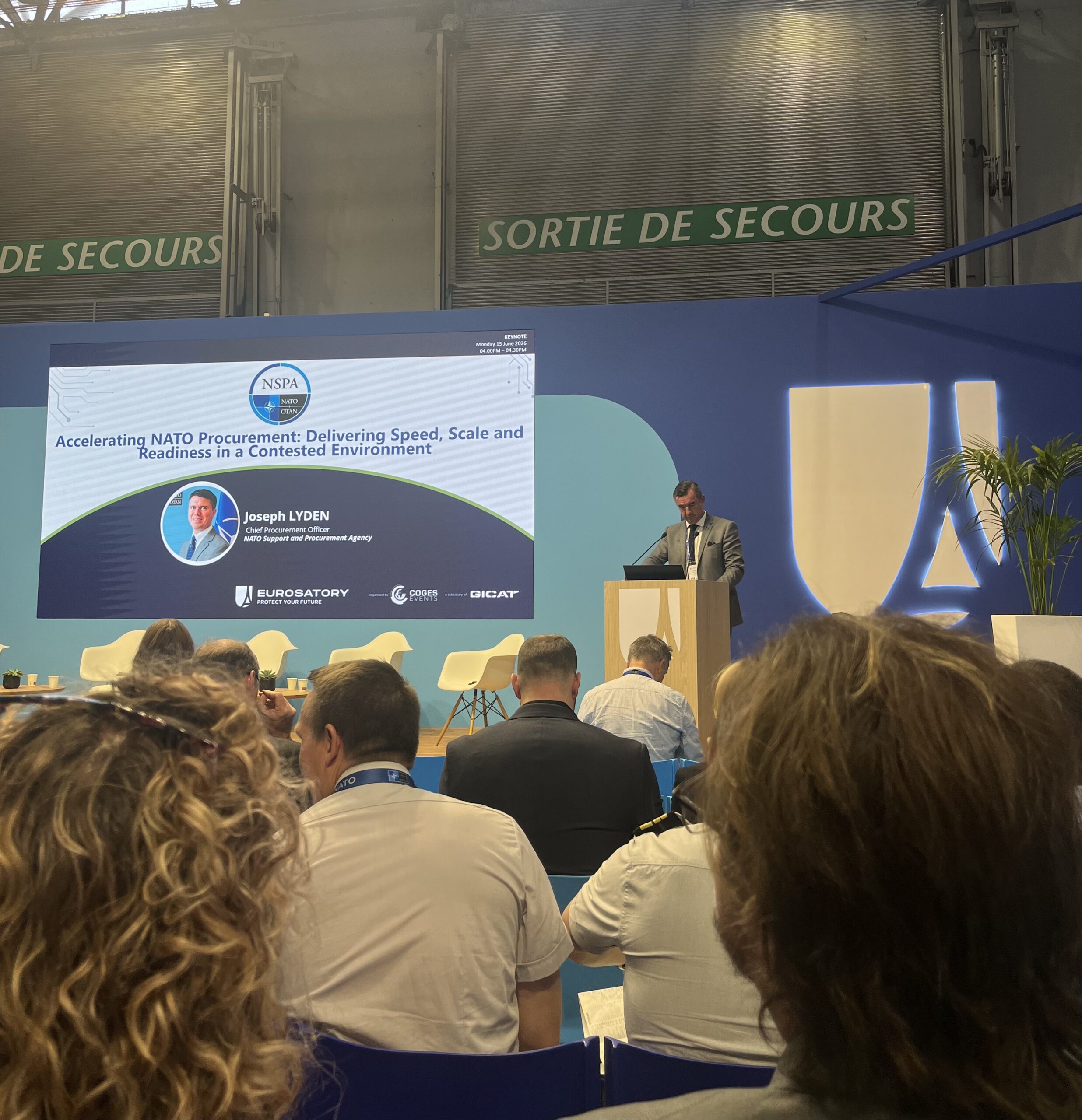 Talk by Joseph Lyden (NATO Support and Procurement Agency) about the acceleration of NATO procurement.