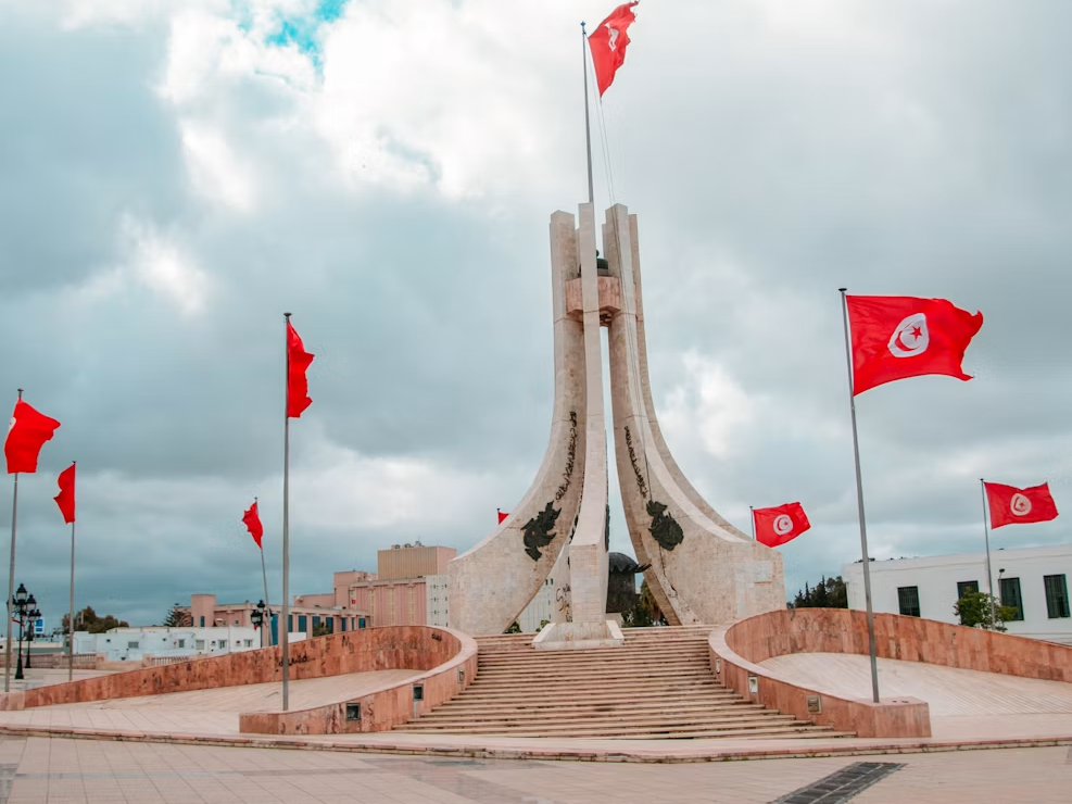 Flag of Tunisia around a monument
